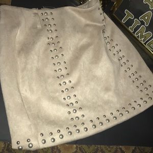 The brand is TOBI, its a size small, beige color